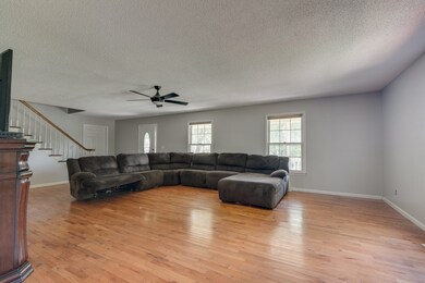 Large and open living room with hardwood flooring!