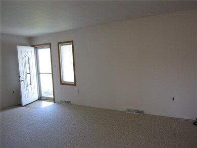 LIVING ROOM WITH NEW CARPETING!