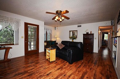 FAMILY ROOM LOOKING DOWN HALLWAY