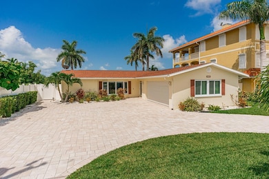 Front exterior with extra large driveway