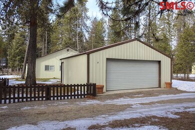 2 car garage has concrete floor and auto door.