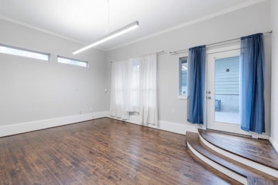 Empty room with wood finished floors, ornamental 