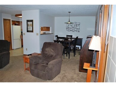 Living room view of dining area and kitchen