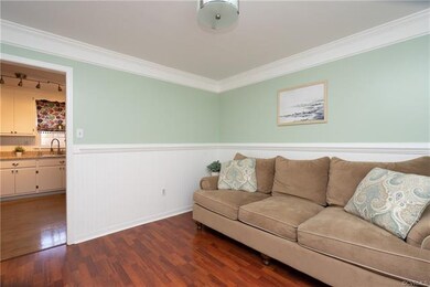 LIVING ROOM/PLAY ROOM HAS BEAUTIFUL CUSTOM MOLDING