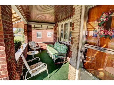 Exterior Front. Enjoy the covered front porch in t
