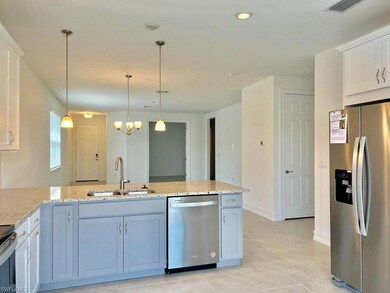 Kitchen featuring visible vents, appliances with s