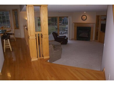 Coming down the hall, you can see the kitchen over