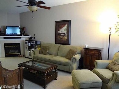 Living Room. The marble surround, gas log fireplace gives a warm ambiance to the dining and living area.