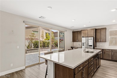 Kitchen featuring tasteful backsplash, a center is