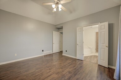 Unfurnished bedroom featuring connected bathroom, 
