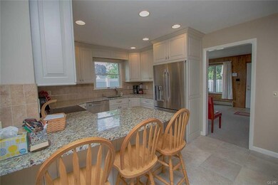 Updated kitchen with granite counters and breakfas