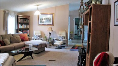 Enter into a very large living room from the cover