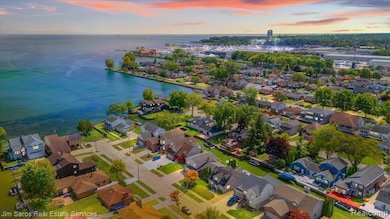 Aerial view at dusk of a water view and a residential view