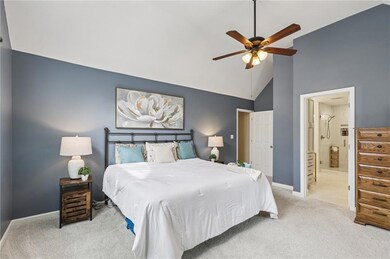 Expanded primary suite with natural light and modern finishes