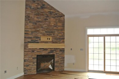Floor to ceiling stone fireplace in family room