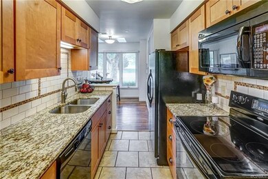 Renovated kitchen includes granite, deep sink and 
