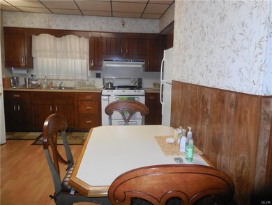 full view of eat in kitchen with laminate flooring