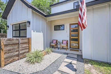 Property entrance featuring board and batten sidi