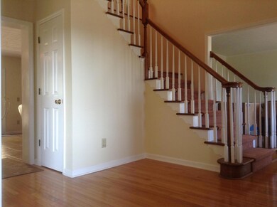 A large foyer welcomes you into this home with stairs leading to the bedrooms.