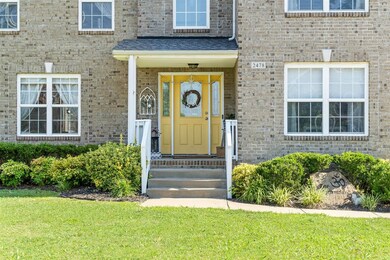 Covered front porch & beautiful landscaping
