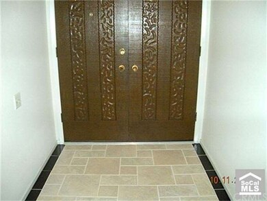 Double Door Entrance to Manor. tiled flooring