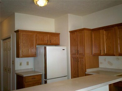 OAK KITCHEN WITH CERAMIC-TILED FLOOR