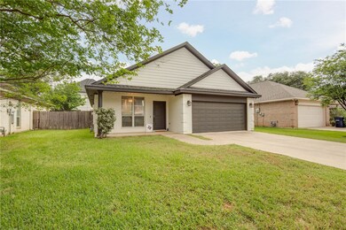 Ranch-style home with brick siding, fence, a front