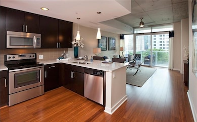 Kitchen with stainless steel appliances, sink, kit