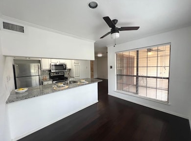 Kitchen with stainless steel appliances, visible v