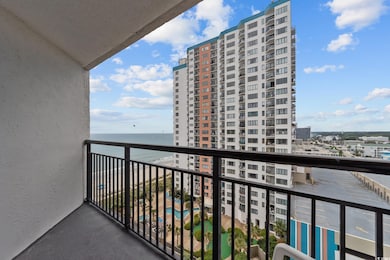 Balcony featuring a city view and a water view