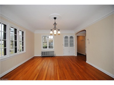 GRACIOUS FORMAL DINING ROOM  IS SUNNY AND BRIGHT