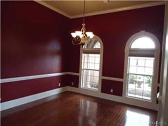 The Formal Dining Room has beautiful cherry wood f