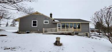 Garage door entrance and side porch view