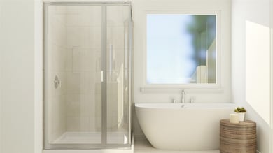 Bathroom with a shower stall and a freestanding tub