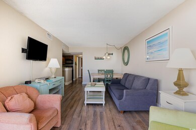 Living room with dark hardwood / wood-style floori