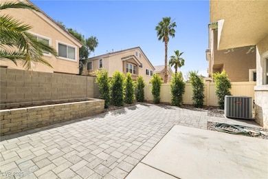 Fenced backyard with central air condition unit an