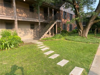 View of grassy yard with stairway
