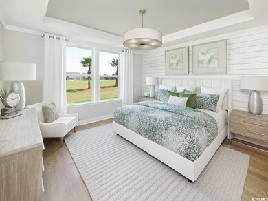 Bedroom featuring a tray ceiling, ornamental molding, wood finished floors, and wooden walls