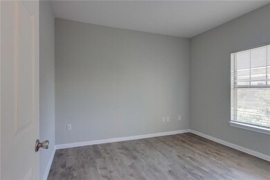Spare room with light wood-style floors and baseboards