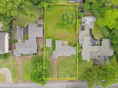 Aerial perspective of suburban area featuring property boundaries highlighted