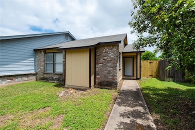 View of front of home featuring brick siding and 