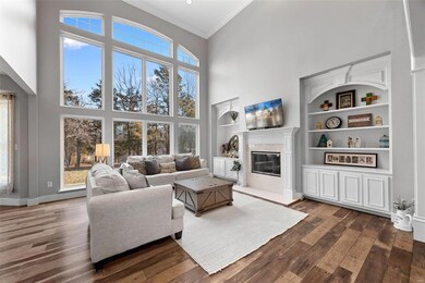 Beautiful gas fireplace flanked by built-ins makes