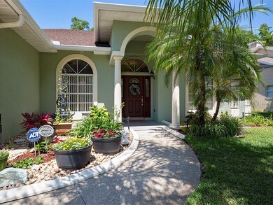 Lush landscaping adorns the  flower beds as they w