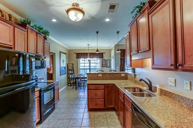 Super nice kitchen with large ceramic tile flooring, granite counter tops and plenty of cabinets!  There is also a fabulous walk-in pantry!