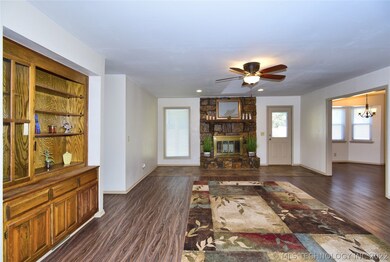 Open living room with built in bookshelves & cabin