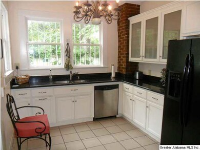 Renovated kitchen with granite counter tops and ta