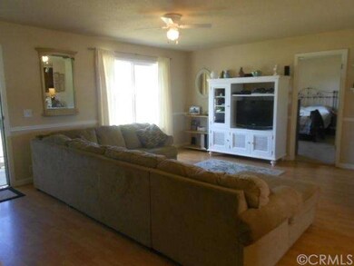 living room and door to master bedroom