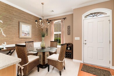 Dining room featuring an accent wall, baseboards, 