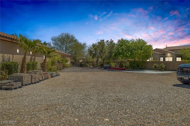 Yard at dusk featuring fence