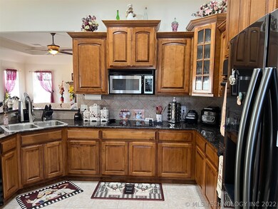 kitchen has beautifully maintained cabinetry & gra